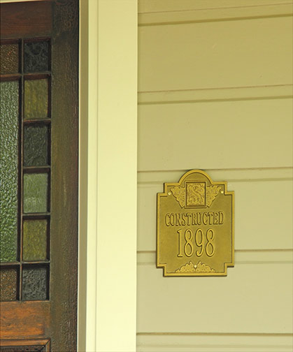door detail and 1898 plaque