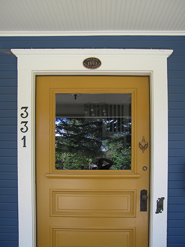 door frame with centennial plaque