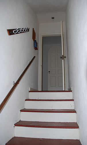 looking up from basement stairs