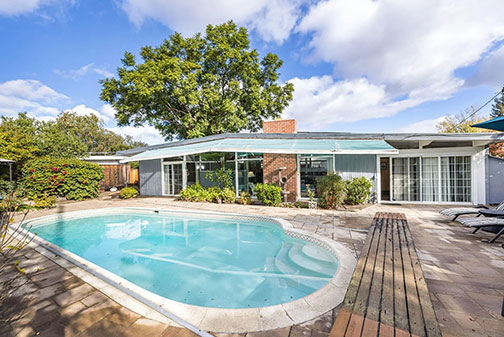 back of house with swimming pool