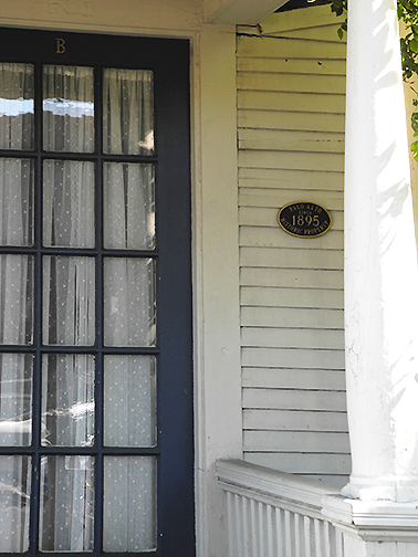 door, plaque, and pillar