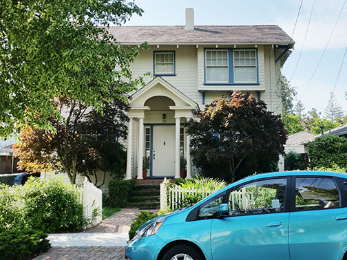 street view with blue car