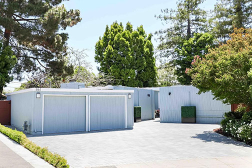 street view of driveway and side of house