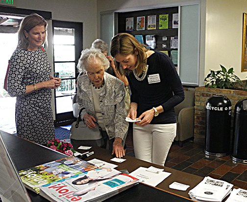 Hayley Stevens, PAST Secretary, at the name tag table